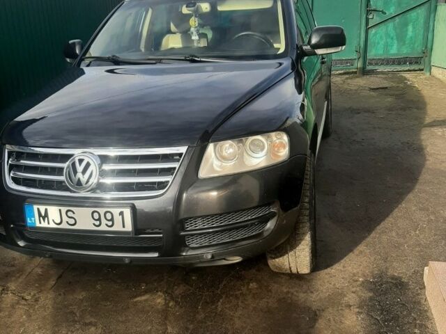 Черный Фольксваген Туарег, объемом двигателя 3 л и пробегом 300 тыс. км за 6500 $, фото 1 на Automoto.ua