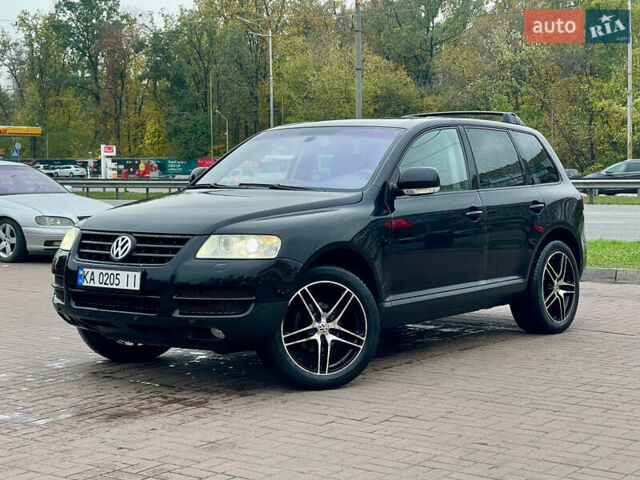 Черный Фольксваген Туарег, объемом двигателя 2.46 л и пробегом 249 тыс. км за 7800 $, фото 1 на Automoto.ua