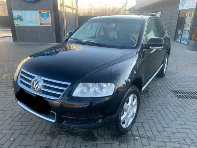 Чорний Фольксваген Туарег, об'ємом двигуна 5 л та пробігом 370 тис. км за 4200 $, фото 1 на Automoto.ua