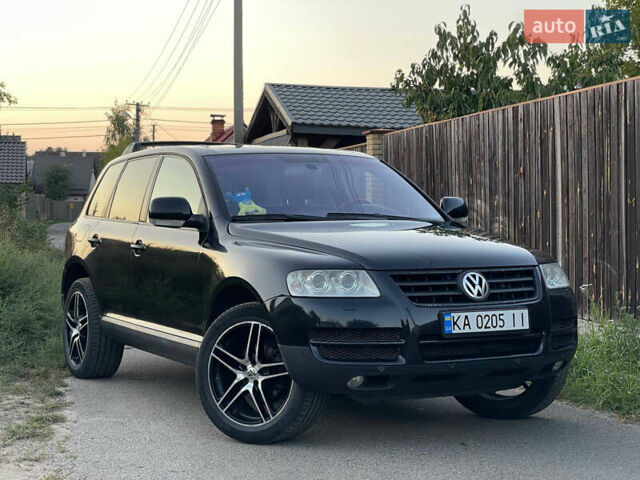 Черный Фольксваген Туарег, объемом двигателя 2.46 л и пробегом 249 тыс. км за 8900 $, фото 1 на Automoto.ua