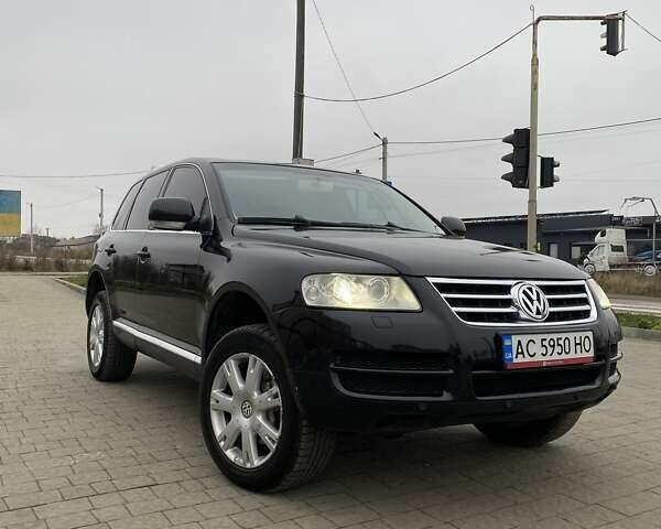 Черный Фольксваген Туарег, объемом двигателя 2.97 л и пробегом 390 тыс. км за 8700 $, фото 1 на Automoto.ua