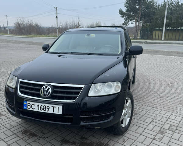 Чорний Фольксваген Туарег, об'ємом двигуна 2.5 л та пробігом 275 тис. км за 6500 $, фото 1 на Automoto.ua