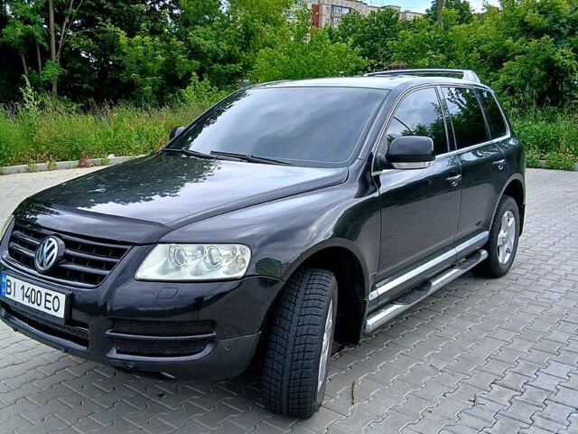 Черный Фольксваген Туарег, объемом двигателя 3.2 л и пробегом 303 тыс. км за 8950 $, фото 1 на Automoto.ua