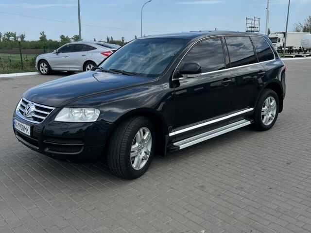 Черный Фольксваген Туарег, объемом двигателя 4.2 л и пробегом 318 тыс. км за 6500 $, фото 1 на Automoto.ua