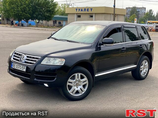 Черный Фольксваген Туарег, объемом двигателя 3.2 л и пробегом 243 тыс. км за 8500 $, фото 1 на Automoto.ua