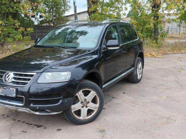 Черный Фольксваген Туарег, объемом двигателя 5 л и пробегом 207 тыс. км за 5500 $, фото 1 на Automoto.ua
