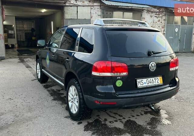 Черный Фольксваген Туарег, объемом двигателя 3 л и пробегом 260 тыс. км за 6000 $, фото 1 на Automoto.ua