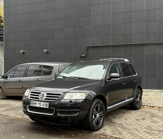 Чорний Фольксваген Туарег, об'ємом двигуна 5 л та пробігом 300 тис. км за 4700 $, фото 1 на Automoto.ua