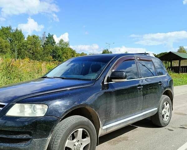 Черный Фольксваген Туарег, объемом двигателя 3 л и пробегом 292 тыс. км за 11500 $, фото 1 на Automoto.ua