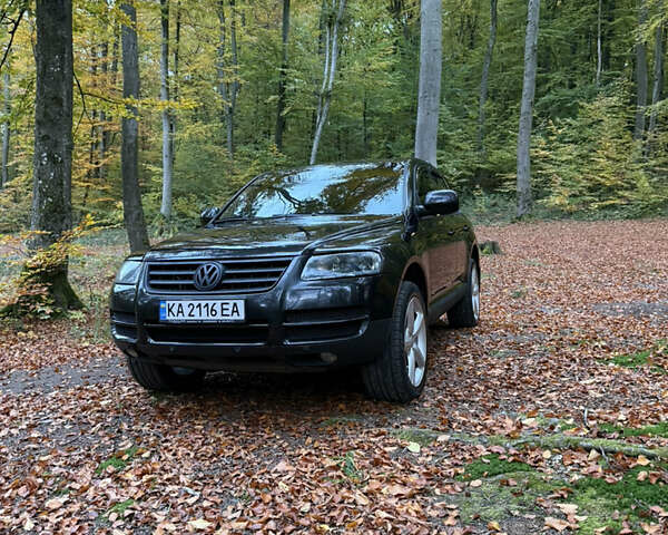 Чорний Фольксваген Туарег, об'ємом двигуна 4.2 л та пробігом 366 тис. км за 8500 $, фото 1 на Automoto.ua