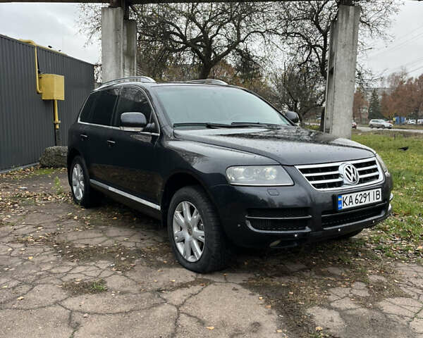 Черный Фольксваген Туарег, объемом двигателя 2.97 л и пробегом 301 тыс. км за 8950 $, фото 1 на Automoto.ua