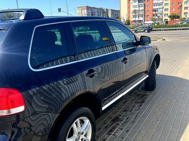 Черный Фольксваген Туарег, объемом двигателя 3 л и пробегом 250 тыс. км за 10700 $, фото 1 на Automoto.ua