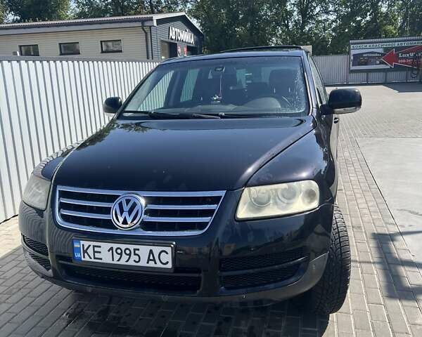 Черный Фольксваген Туарег, объемом двигателя 3 л и пробегом 250 тыс. км за 9700 $, фото 1 на Automoto.ua