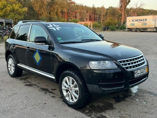 Чорний Фольксваген Туарег, об'ємом двигуна 3 л та пробігом 260 тис. км за 6410 $, фото 1 на Automoto.ua