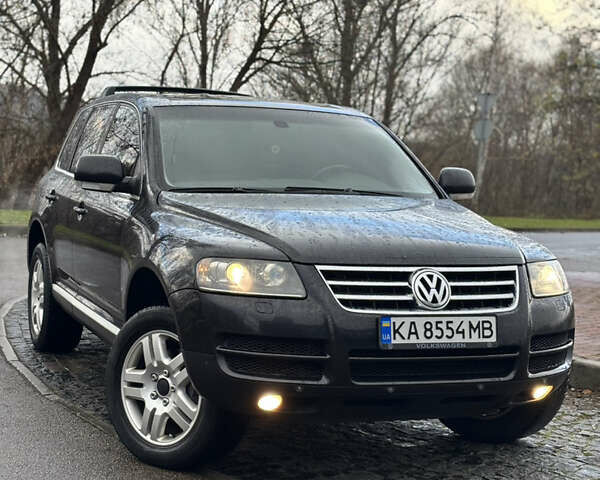 Чорний Фольксваген Туарег, об'ємом двигуна 3.2 л та пробігом 250 тис. км за 7500 $, фото 1 на Automoto.ua