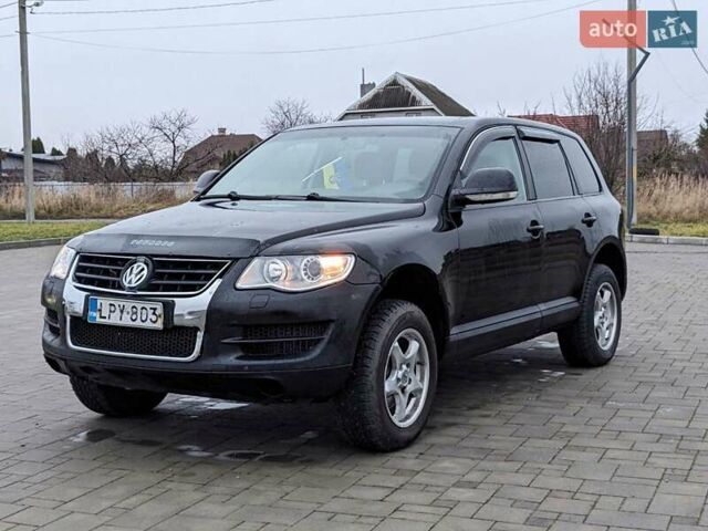 Черный Фольксваген Туарег, объемом двигателя 3 л и пробегом 305 тыс. км за 5850 $, фото 1 на Automoto.ua