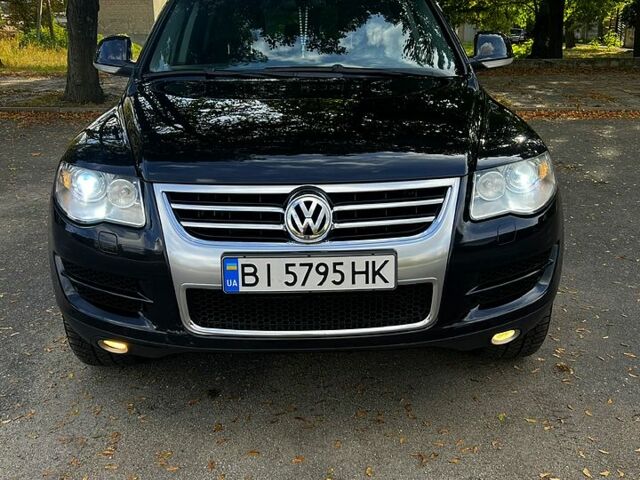 Черный Фольксваген Туарег, объемом двигателя 3 л и пробегом 325 тыс. км за 13000 $, фото 1 на Automoto.ua