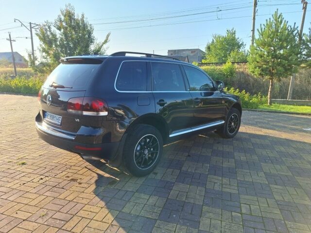 Черный Фольксваген Туарег, объемом двигателя 3.6 л и пробегом 305 тыс. км за 12800 $, фото 1 на Automoto.ua