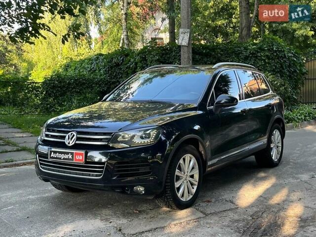 Чорний Фольксваген Туарег, об'ємом двигуна 4.2 л та пробігом 255 тис. км за 28440 $, фото 1 на Automoto.ua