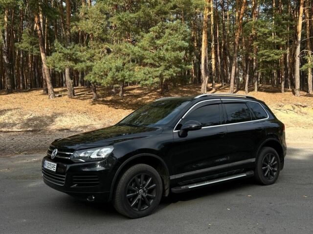 Чорний Фольксваген Туарег, об'ємом двигуна 3 л та пробігом 239 тис. км за 21200 $, фото 1 на Automoto.ua