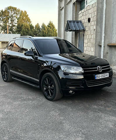 Черный Фольксваген Туарег, объемом двигателя 3 л и пробегом 294 тыс. км за 18500 $, фото 1 на Automoto.ua