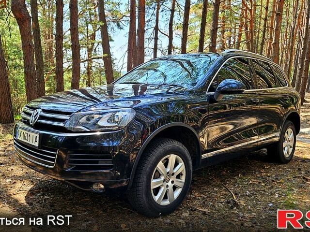 Черный Фольксваген Туарег, объемом двигателя 3 л и пробегом 350 тыс. км за 18500 $, фото 1 на Automoto.ua