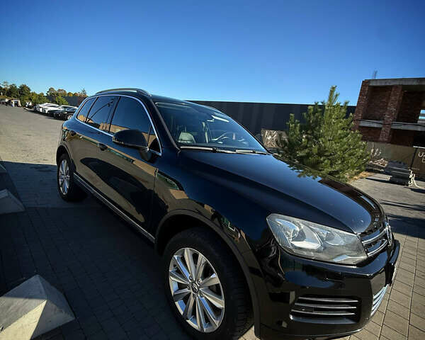 Черный Фольксваген Туарег, объемом двигателя 3 л и пробегом 213 тыс. км за 22300 $, фото 1 на Automoto.ua