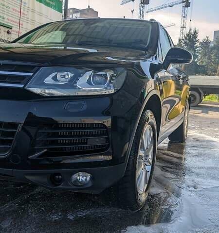 Чорний Фольксваген Туарег, об'ємом двигуна 3 л та пробігом 214 тис. км за 28000 $, фото 1 на Automoto.ua