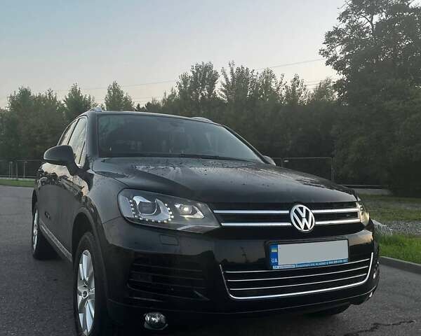 Черный Фольксваген Туарег, объемом двигателя 3 л и пробегом 221 тыс. км за 24516 $, фото 1 на Automoto.ua