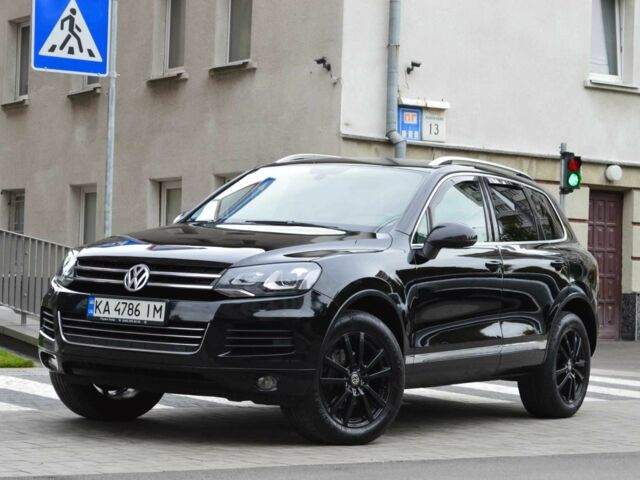 Черный Фольксваген Туарег, объемом двигателя 3 л и пробегом 256 тыс. км за 18900 $, фото 1 на Automoto.ua