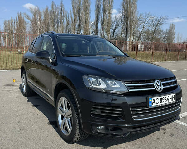 Черный Фольксваген Туарег, объемом двигателя 2.97 л и пробегом 257 тыс. км за 24000 $, фото 1 на Automoto.ua