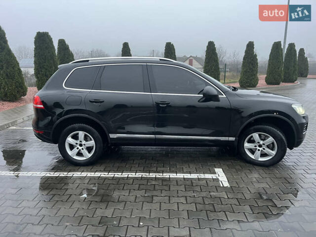 Черный Фольксваген Туарег, объемом двигателя 3 л и пробегом 265 тыс. км за 21500 $, фото 1 на Automoto.ua