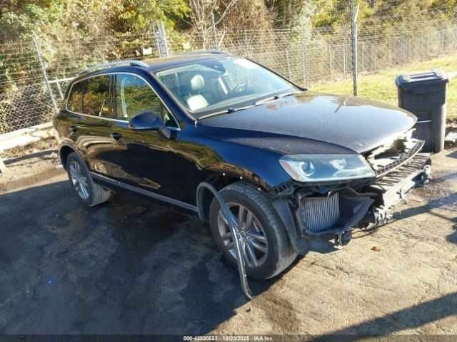 Черный Фольксваген Туарег, объемом двигателя 3 л и пробегом 170 тыс. км за 3000 $, фото 1 на Automoto.ua