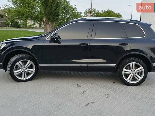 Черный Фольксваген Туарег, объемом двигателя 3 л и пробегом 230 тыс. км за 34500 $, фото 1 на Automoto.ua