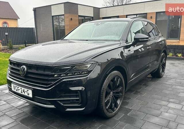 Чорний Фольксваген Туарег, об'ємом двигуна 3 л та пробігом 145 тис. км за 49990 $, фото 1 на Automoto.ua