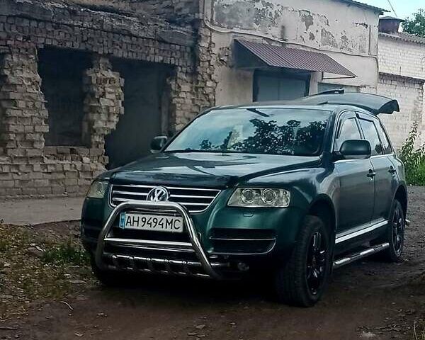 Серый Фольксваген Туарег, объемом двигателя 4.9 л и пробегом 260 тыс. км за 6000 $, фото 1 на Automoto.ua