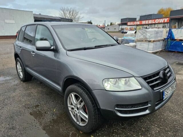 Серый Фольксваген Туарег, объемом двигателя 2.5 л и пробегом 296 тыс. км за 2600 $, фото 1 на Automoto.ua