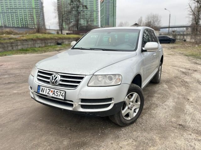 Серый Фольксваген Туарег, объемом двигателя 3 л и пробегом 340 тыс. км за 5500 $, фото 1 на Automoto.ua