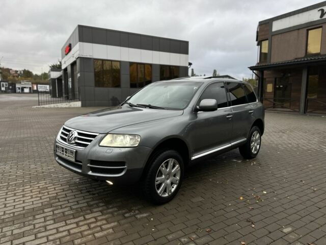 Серый Фольксваген Туарег, объемом двигателя 3 л и пробегом 370 тыс. км за 5450 $, фото 1 на Automoto.ua