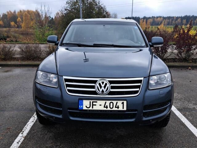 Сірий Фольксваген Туарег, об'ємом двигуна 3 л та пробігом 394 тис. км за 6000 $, фото 1 на Automoto.ua