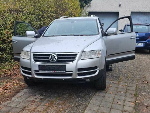 Сірий Фольксваген Туарег, об'ємом двигуна 3 л та пробігом 302 тис. км за 6402 $, фото 1 на Automoto.ua