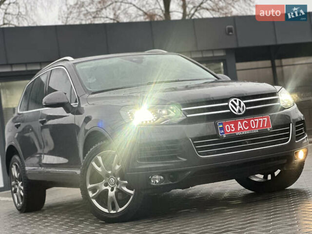 Сірий Фольксваген Туарег, об'ємом двигуна 3 л та пробігом 298 тис. км за 18500 $, фото 1 на Automoto.ua