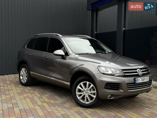 Серый Фольксваген Туарег, объемом двигателя 2.97 л и пробегом 360 тыс. км за 17500 $, фото 1 на Automoto.ua