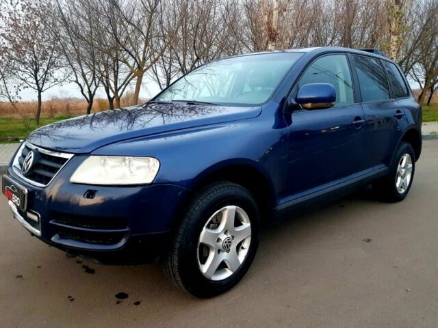 Синій Фольксваген Туарег, об'ємом двигуна 3 л та пробігом 300 тис. км за 9500 $, фото 1 на Automoto.ua