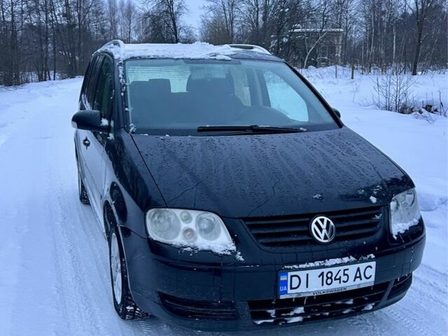 Чорний Фольксваген Туран, об'ємом двигуна 2 л та пробігом 300 тис. км за 4999 $, фото 1 на Automoto.ua