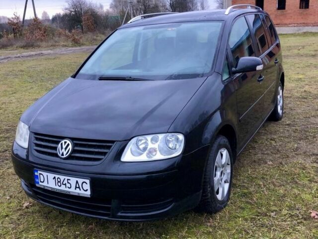 Черный Фольксваген Туран, объемом двигателя 2 л и пробегом 400 тыс. км за 4999 $, фото 1 на Automoto.ua