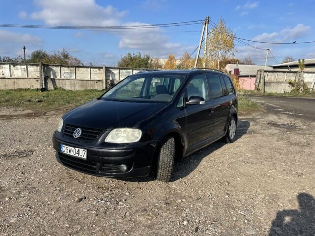 Черный Фольксваген Туран, объемом двигателя 2 л и пробегом 250 тыс. км за 2500 $, фото 1 на Automoto.ua