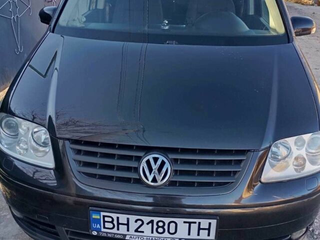 Черный Фольксваген Туран, объемом двигателя 2 л и пробегом 400 тыс. км за 6000 $, фото 1 на Automoto.ua