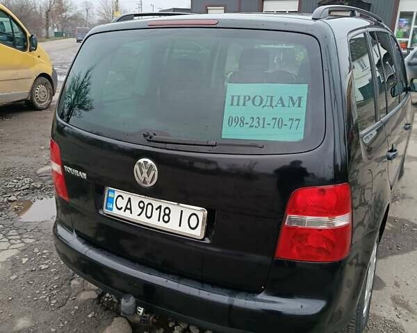 Черный Фольксваген Туран, объемом двигателя 1.6 л и пробегом 304 тыс. км за 4500 $, фото 1 на Automoto.ua