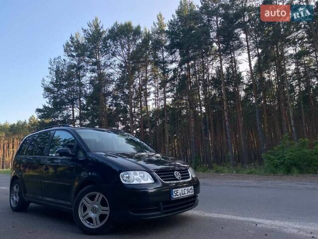 Черный Фольксваген Туран, объемом двигателя 1.9 л и пробегом 336 тыс. км за 2950 $, фото 1 на Automoto.ua